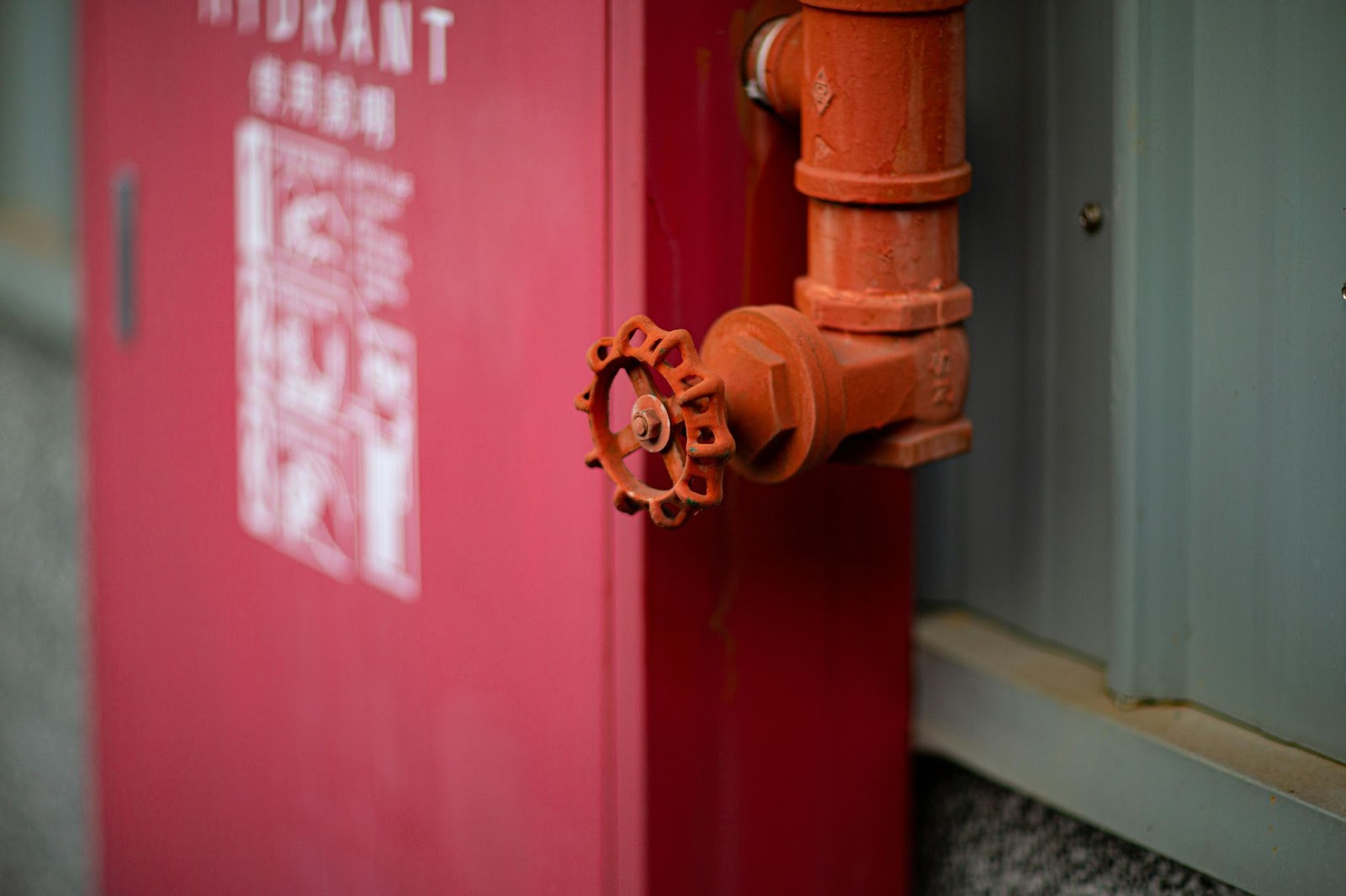 A red metal pipe with flange check valves